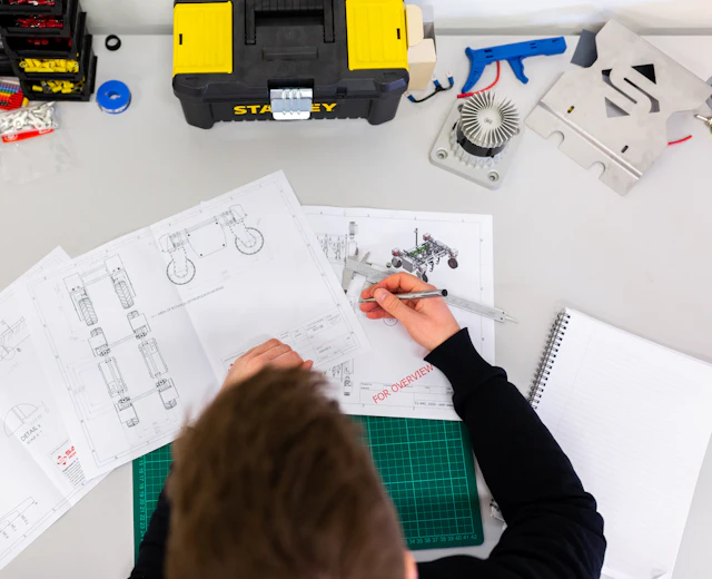 Engineer planning a job from technical drawings